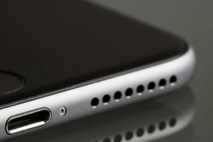 Photo of smartphone managed under enterprise IT policies.