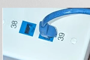 Image of a surface mount box with keystone jacks for structured cabling support.