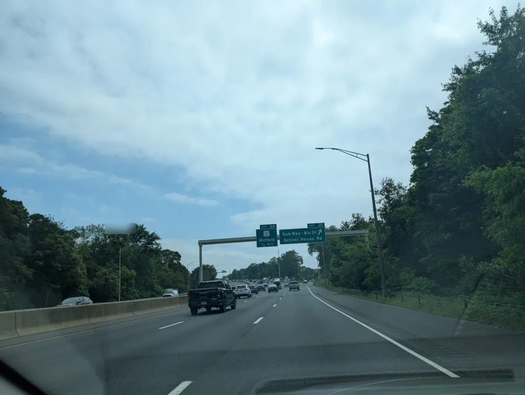 Highway exit sign to Milford, CT where Infinigence provides IT support services.